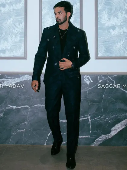 A full look of Shakti Yadav in our dark blue suit, combining military-inspired details with a sophisticated edge.