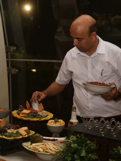 A throwback to me setting up a grazing platter at an event. It's a hands-on process to ensure everything looks as good as it tastes.
