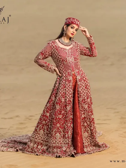 A full view of the rose-gold Indo-Western outfit with a long tail, handcrafted with zardozi work and a magnificent dupatta for an enticing and attractive appearance.