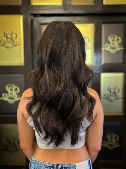 Light golden hues blended into a rich brown base. This hair makeover gives a warm, sun-kissed feel that looks effortlessly beautiful.