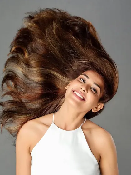 This copper brown color adds so much warmth and dimension. The hair flip shows the beautiful movement and the way the light catches the different tones, from deep brown to bright copper.