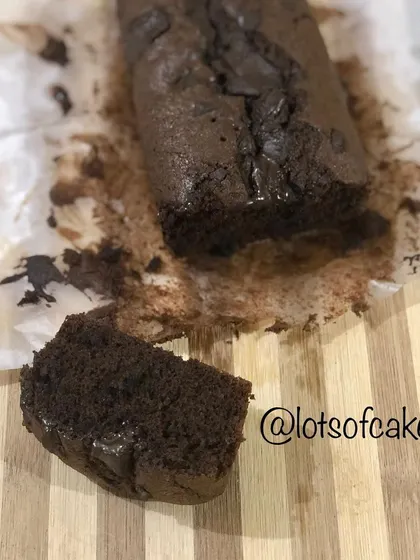 A single, thick slice cut from the double chocolate banana loaf, showing just how moist and rich the crumb is.