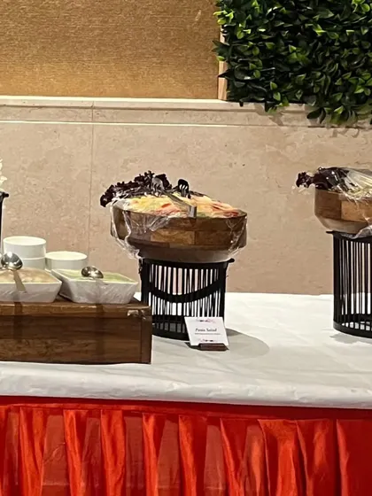Our salad bar setup for a "Chaat Fiesta" event, with bowls of fresh ingredients and dressings ready for guests to create their own custom salads.