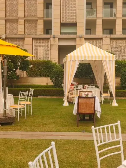 The mix of yellow umbrellas and striped cabanas creates a visually cohesive and sunny atmosphere for the outdoor brunch. We pay close attention to color palettes to ensure a consistent theme.