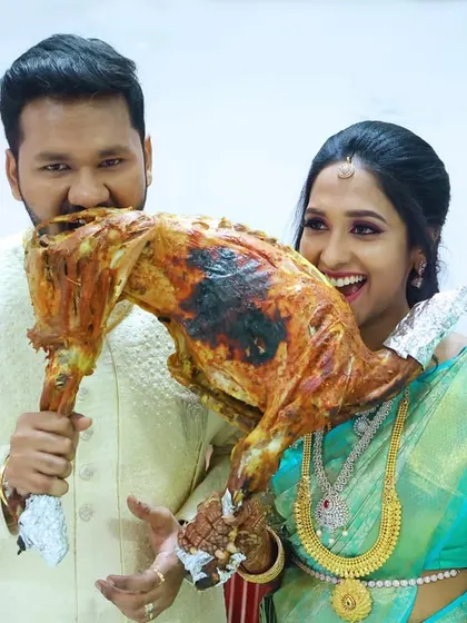 A playful moment between the couple and our signature roasted mutton.