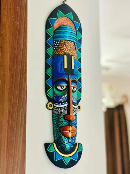 The painted mask in a different light, showing how the metallic and bright colors interact. It's a testament to my belief that almost anything can be a canvas.