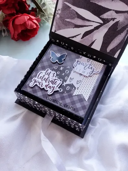 This black and white themed mini scrapbook was a gift for a sister. The monochrome design with a pop of blue gives it a chic and modern feel.