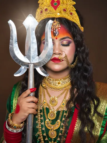 A serene yet powerful pose with the trishul, showcasing the student's ability to direct and capture a character.
