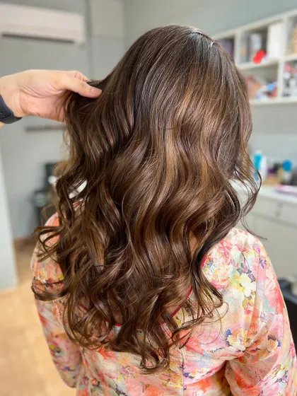 A beautiful sunkissed balayage that adds light and dimension. This technique is perfect for a natural, lived-in color.