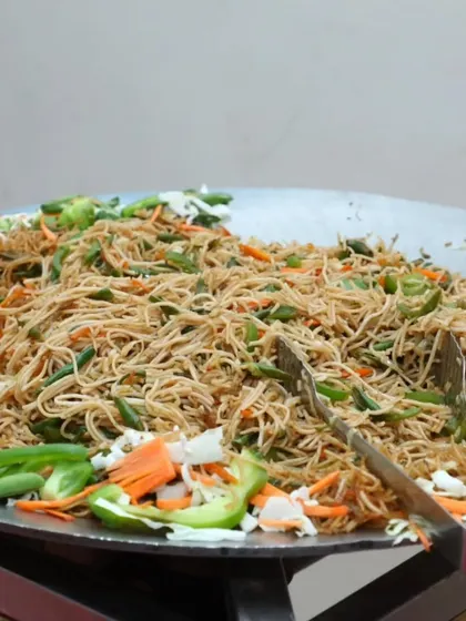 A large platter of vegetable hakka noodles, another popular Indo-Chinese option for parties.