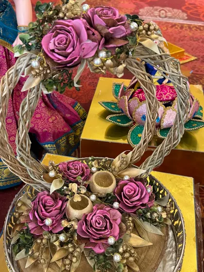 A beautifully crafted ring platter with a rustic wicker heart and dried flowers.