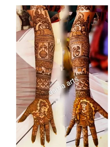 This design showcases the beautiful journey of a wedding. It includes portraits of Radha and Krishna on the palms, along with traditional symbols like the kalash (pot) and elephants, representing blessings and prosperity.