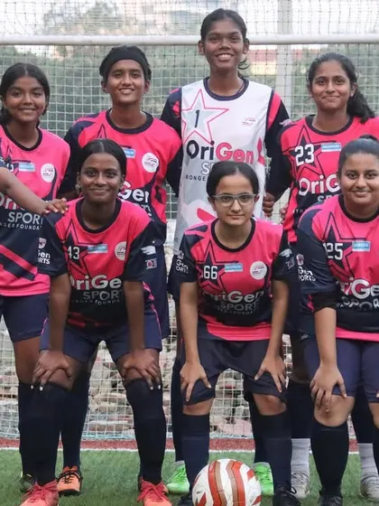 Our girls' team stands united for a pre-match photo at the TGIF x She Kicks Football League, ready to give their all on the pitch.