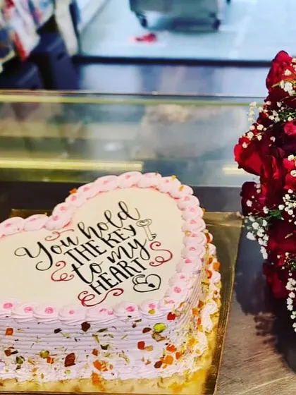 Say it with a cake. This heart-shaped cake features a romantic message, "You hold the key to my heart," making it a perfect gift for Valentine's Day or an anniversary.