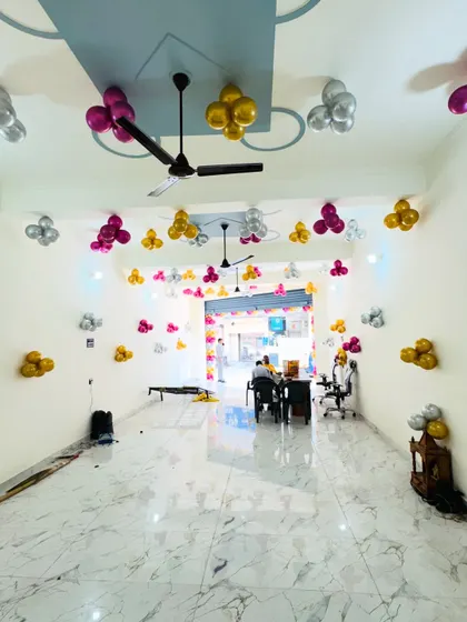 A view from the back of the office, showing the balloon decorations throughout the space.
