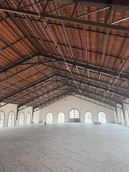 We have experience with large commercial and industrial spaces. This photo shows a massive warehouse-style building we painted, ensuring a clean and professional finish across a very large surface area.