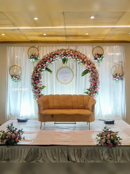 The full setup for the circular floral arch stage.