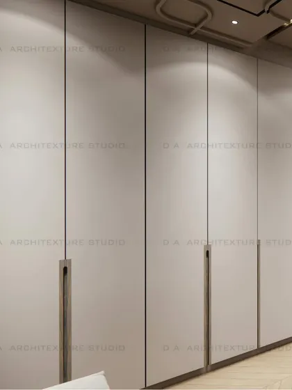The sleek, minimalist wardrobe design for the day room, with clean lines and integrated handles.