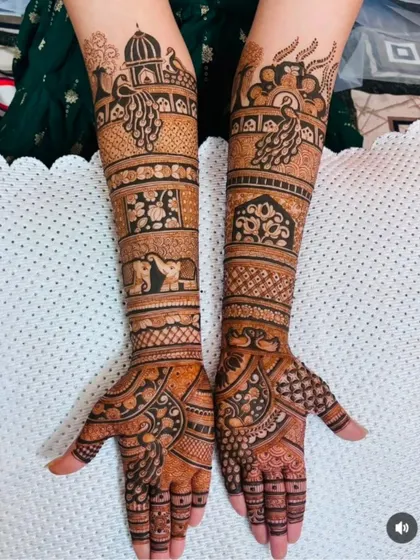 A lovely design with peacocks, elephants, and floral bands, creating a classic and timeless bridal look.