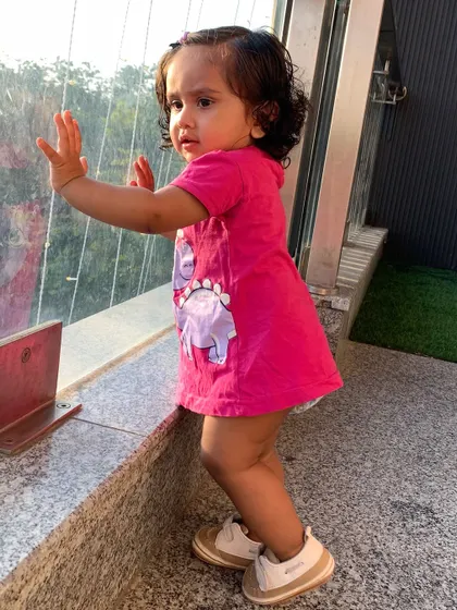 My daughter enjoying the view from our balcony.