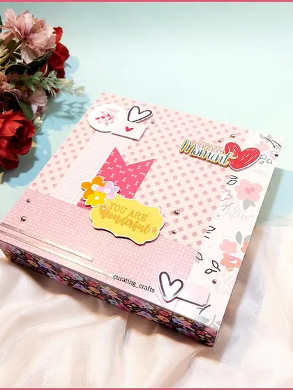 The cover of a pretty pink hamper box, customized for a client's fiancée.