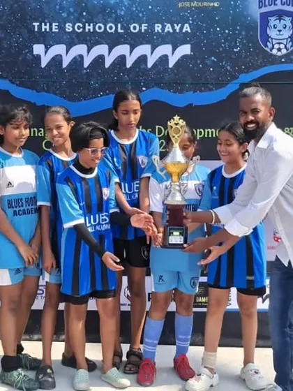 Our coach presenting the runners-up trophy to the women's sub-junior team. Recognition from a mentor is a powerful part of a player's development journey.