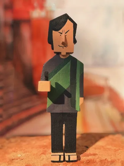 This is my wooden interpretation of Feluda, the central character of the 'Joy Baba Felunath' series. The sharp, geometric carving style gives this collectible a distinct and modern artistic feel.