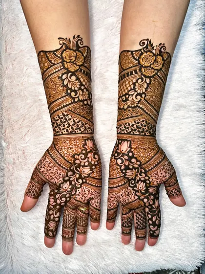 I love combining different styles, like in this full-arm design where bold floral roses meet delicate traditional patterns. The contrast between the dark-filled areas and the intricate line work makes the design pop.