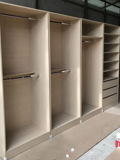 This image shows the sturdy carcass of a wardrobe unit before the shutters and accessories are added. You can see the clean construction and precise compartments, which form the foundation of a long-lasting storage solution.