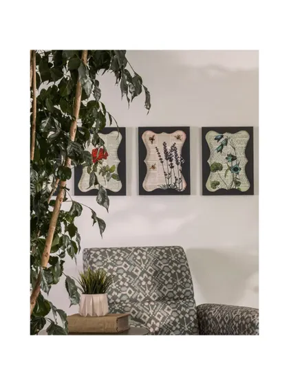 A trio of framed botanical prints adds a touch of nature and artistry to a sitting area. These details are essential for making a commercial space feel curated and personal.