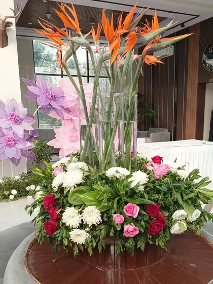 A large floral centerpiece featuring exotic Birds of Paradise flowers, adding a touch of tropical elegance to a Jim Corbett wedding.