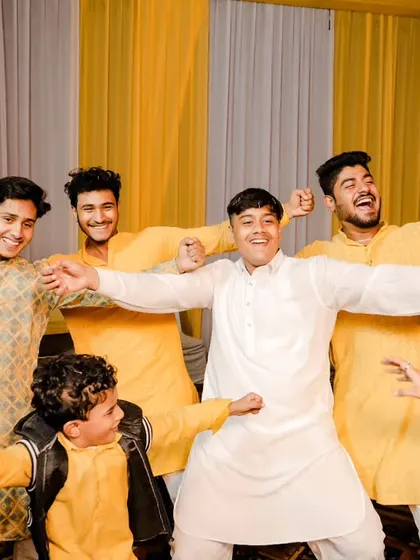 The bride's brothers having a blast at the Haldi ceremony. We love capturing these moments of family fun and bonding.