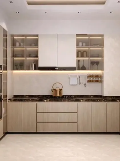 A well-organized U-shaped kitchen with light wood cabinets and a dark marble countertop. The design includes glass-front upper cabinets with internal lighting to display fine crockery.