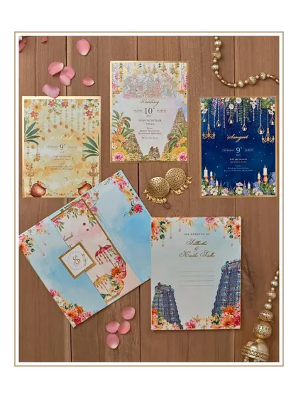 A riot of colors celebrating a truly South Indian spirit. This invitation suite is filled with vibrant illustrations of temple architecture, floral garlands, and traditional patterns.