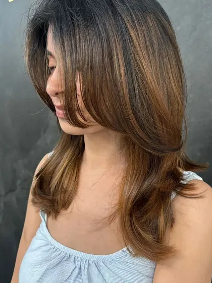 It doesn't matter if your life is perfect as long as your hair color is. This layered cut enhances the beautiful balayage.