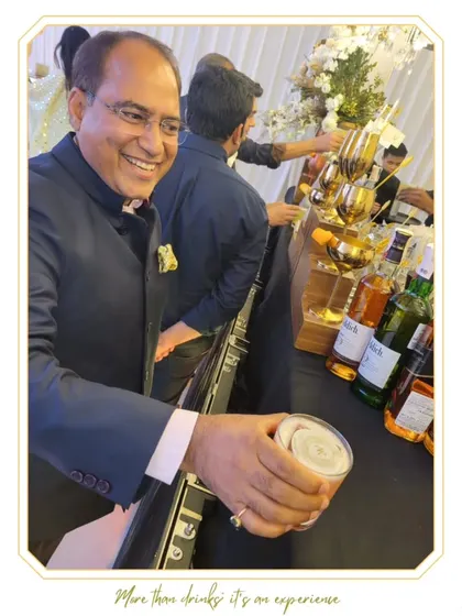 A guest's face lights up with a huge smile as he receives his drink. This is the kind of happy, positive interaction our team strives for.