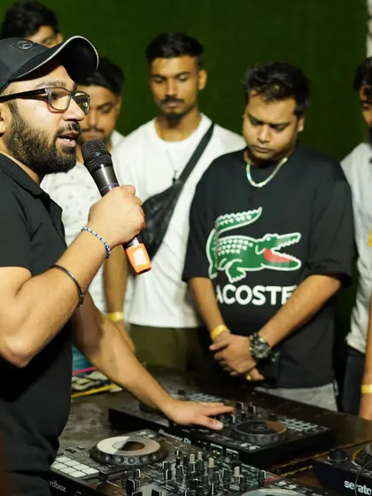 Learning is interactive here. An instructor demonstrates mixing techniques on a Pioneer controller to an attentive group of aspiring DJs during our FLYP 2.0 workshop.