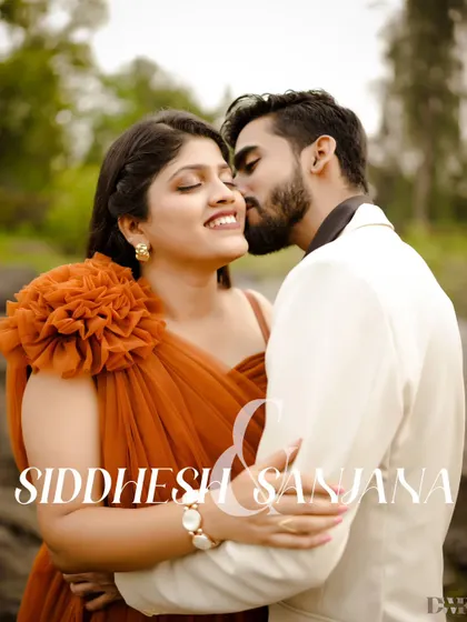 A gentle kiss, a moment of pure affection. This close-up portrait captures the intimacy of the couple, with the soft, natural background enhancing the romantic mood.
