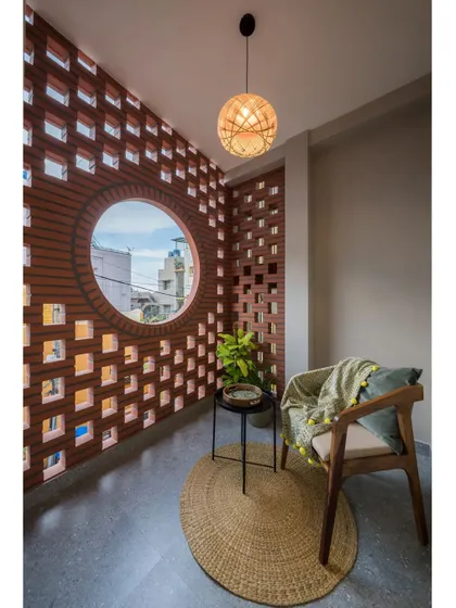 Another perspective of the Mathrukrupa balcony, emphasizing the beautiful texture and pattern of the terracotta jali wall.