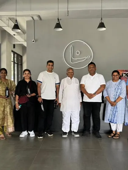 A group photo with our esteemed guests at the entrance of our academy, a testament to our growing reputation in the sports community.