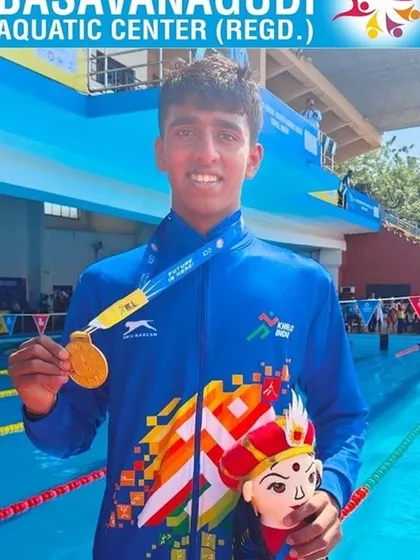 Dhanush S celebrating his gold medal in the 200m Butterfly.