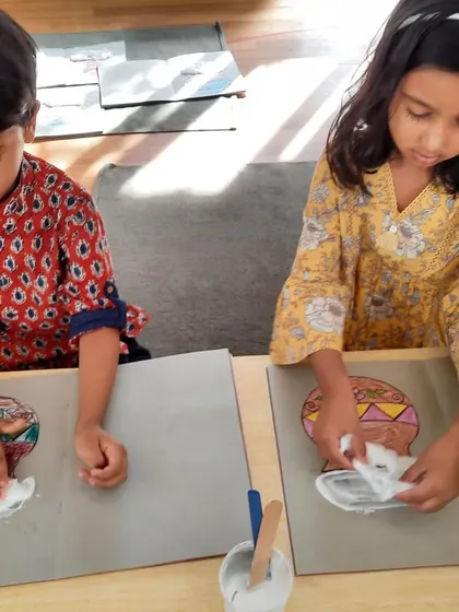 Celebrating the harvest festival, our little folks are creating art that reflects the traditions of the season. Here, they are using cotton to represent the overflowing bounty in a pot, connecting culture with creativity.