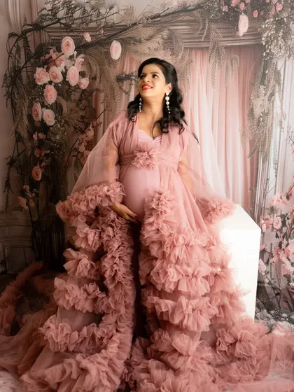 A magnificent portrait in a ruffled pink robe from my client wardrobe. The upward gaze and soft lighting create a regal and dreamy look.