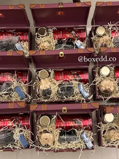 Another view of our assembly center during the busy Diwali season. These deep red trunk hampers are being filled and organized for large-scale corporate gifting orders.