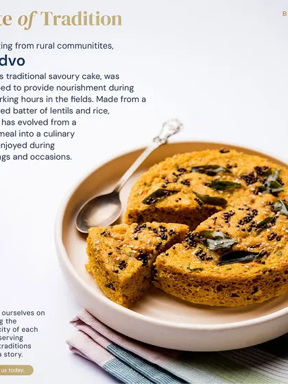 Handvo is Gujarat's traditional savory cake, made from a fermented batter of lentils and rice. We honor its rustic origins by preserving its authentic taste and texture.