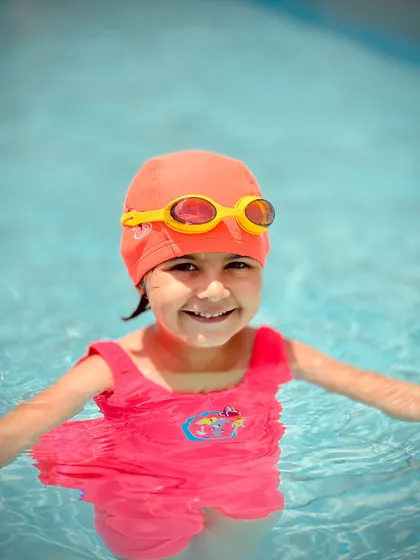 A happy and confident smile from one of our young students. We believe that feeling comfortable in the water is the first step to becoming a great swimmer.