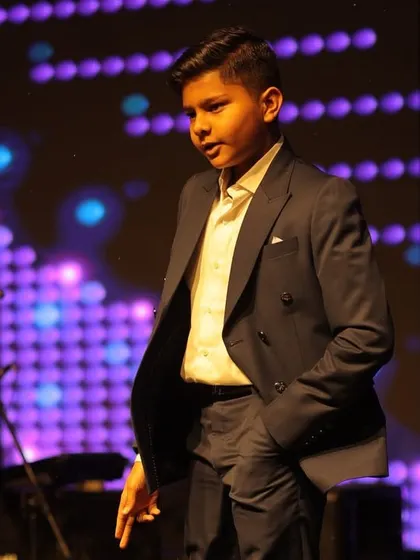 The youngest performer of the night, looking sharp and confident. We love teaching kids and making them feel like stars.
