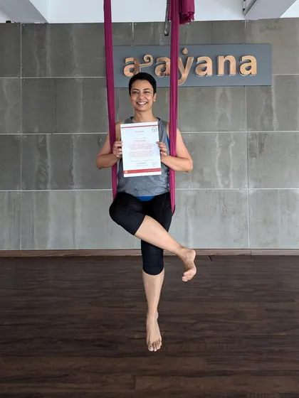 A simple, elegant pose from a new graduate, showcasing the confidence gained during our aerial course.