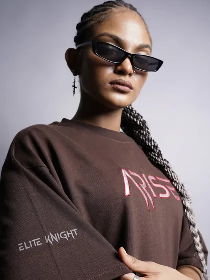 An even tighter close-up that brings focus to the sleeve detail and the model's sharp look. This type of shot is great for showcasing the smaller, unique elements of a garment.