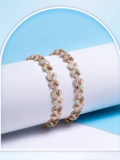 This pastel enamel bangle with a stunning rhodium finish is the perfect blend of sophistication and charm. The butterfly motifs add a touch of whimsy.